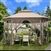 Outdoor 10 x 12 Ft Octagon Gazebo with Mosquito Net Sidewalls and Brown Canopy